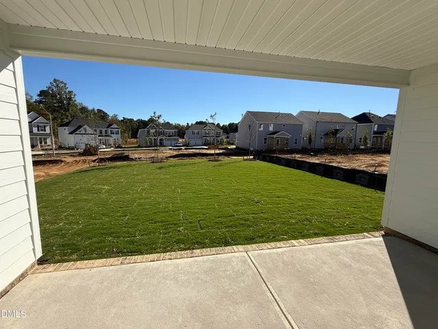 a view of a pool with a yard