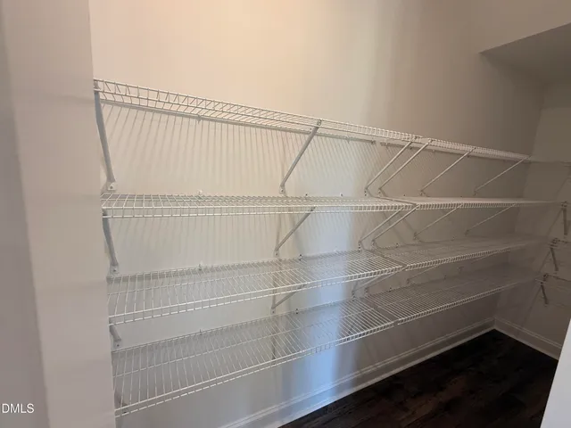 a view of a room with racks on the wall