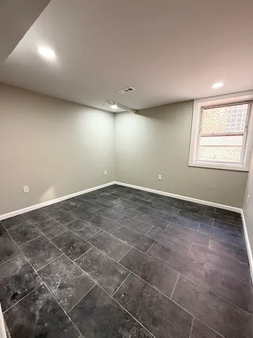 a view of an empty room with windows