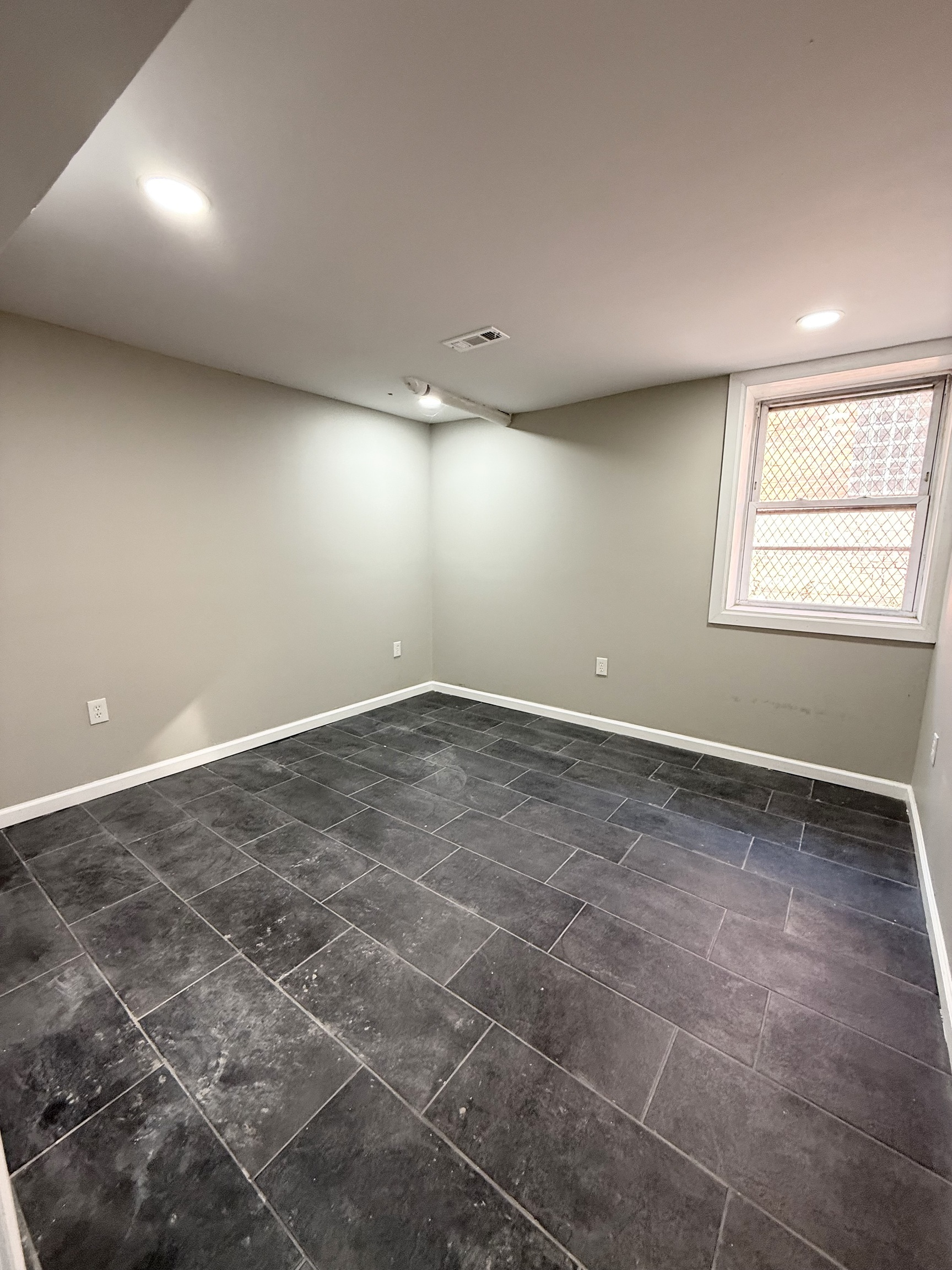 41 Howe Street New Haven, CT 06511 - Photo 8 of 11 an empty room with a natural light