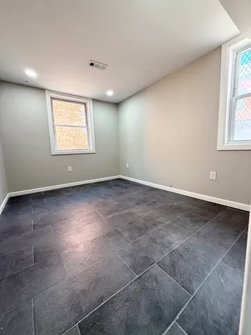 a white toilet sitting next to a bathroom sink