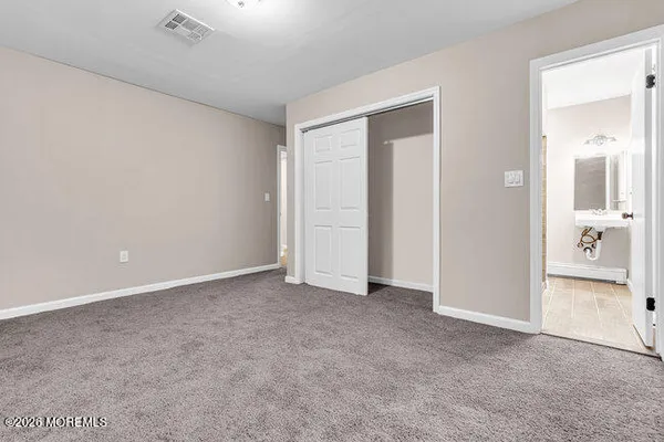 an empty room with a bathroom