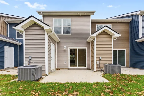 a view of a house with a yard and plants