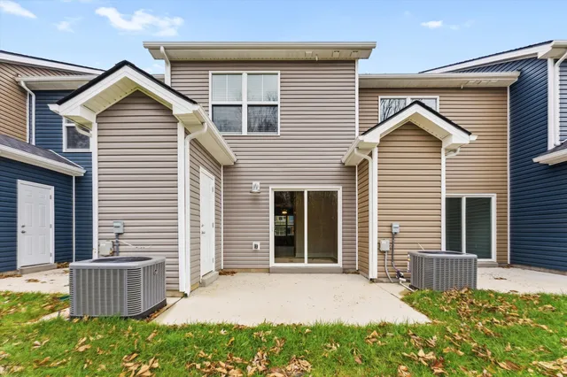 a view of a house with a yard and plants
