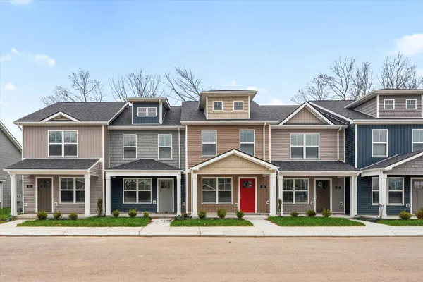 a front view of a residential houses with street