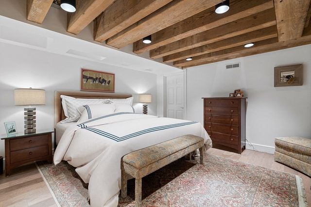 a bedroom with a bed and a desk