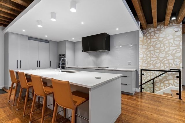 a kitchen with a table and chairs in it