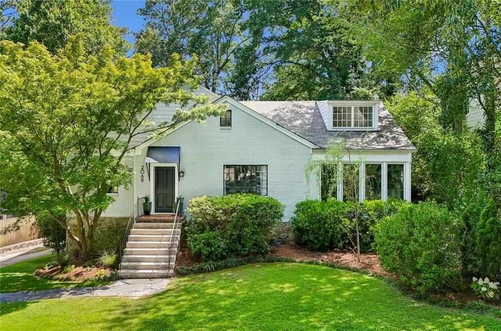 2069 Edinburgh Terrace Northeast Atlanta, GA 30307 - Photo 3 of 72 a front view of a house with a yard
