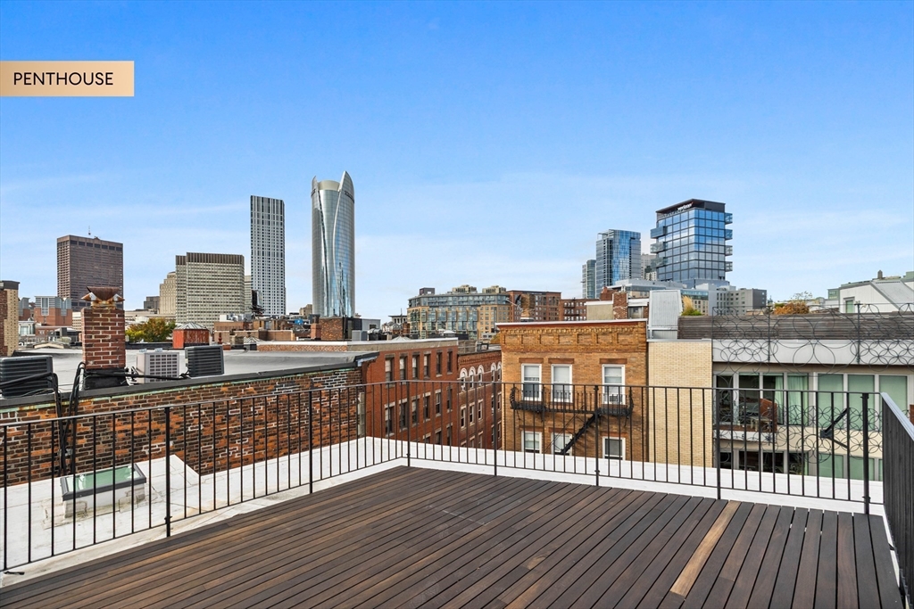 133 Salem Street Boston, MA 02113 - Photo 15 of 27 a view of a balcony with wooden floor