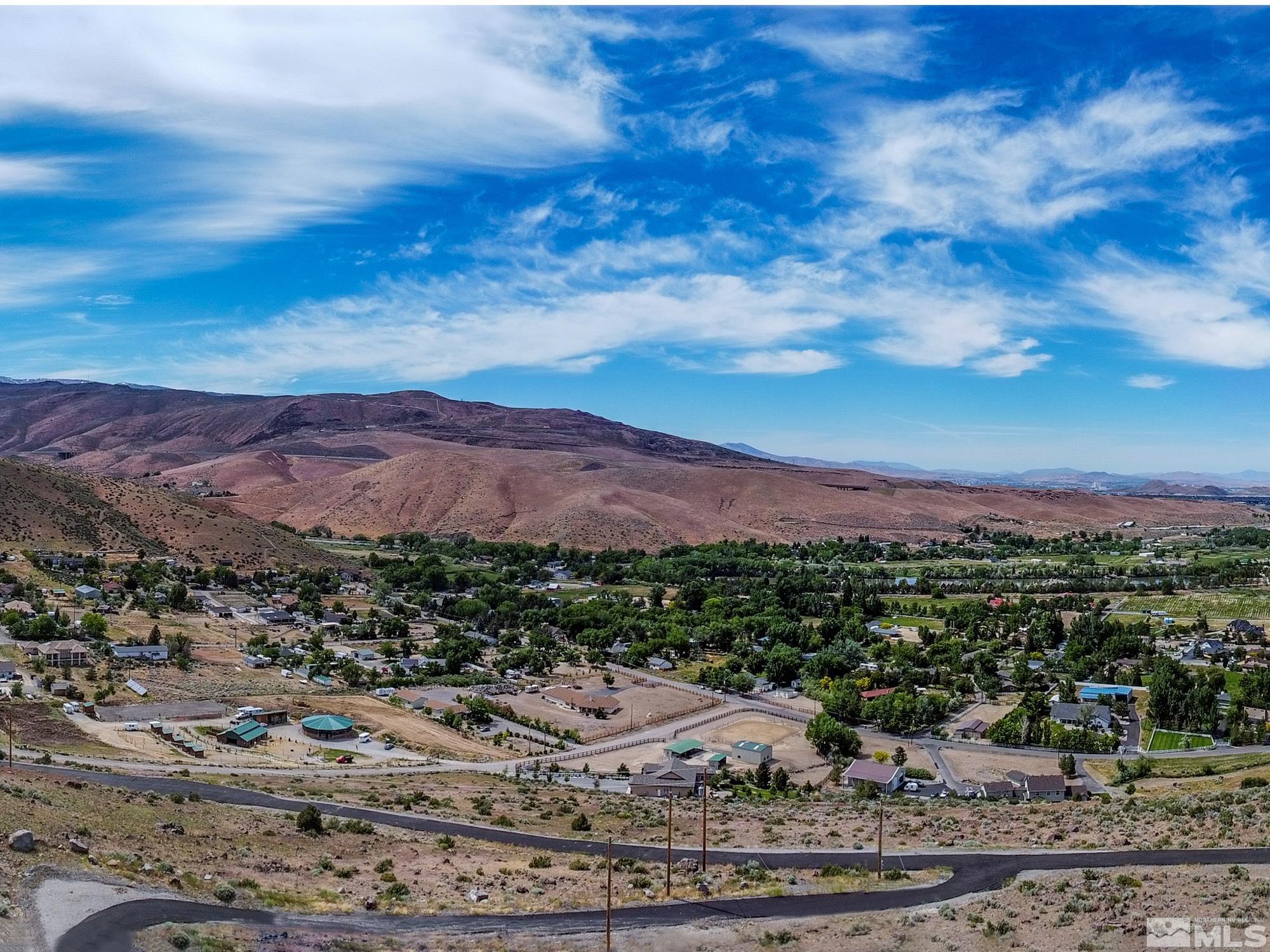 20130 Carpenter Lane Reno, NV 89521 - Photo 5 of 11 a view of a city with mountains in the background