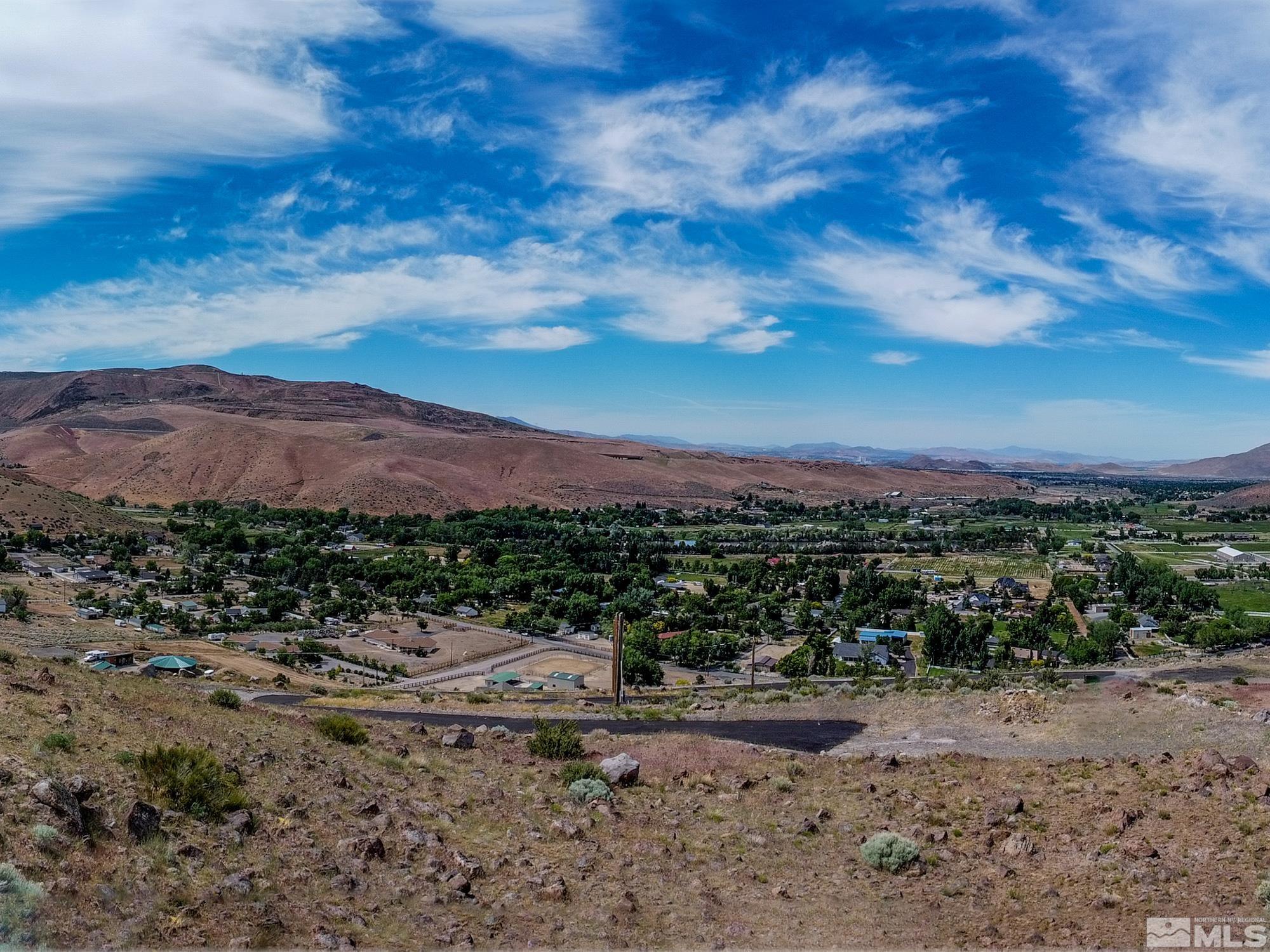 20130 Carpenter Lane Reno, NV 89521 - Photo 7 of 11 a view of a dry yard with mountains