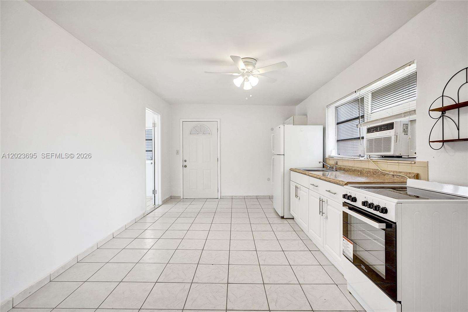 877 West 33rd Street, Unit A Hialeah, FL 33012 - Photo 17 of 36 Kitchen/Family/Dining Area