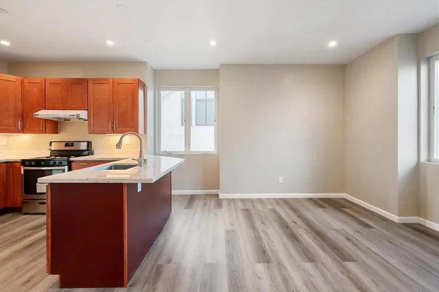 a kitchen with wooden cabinets and a sink