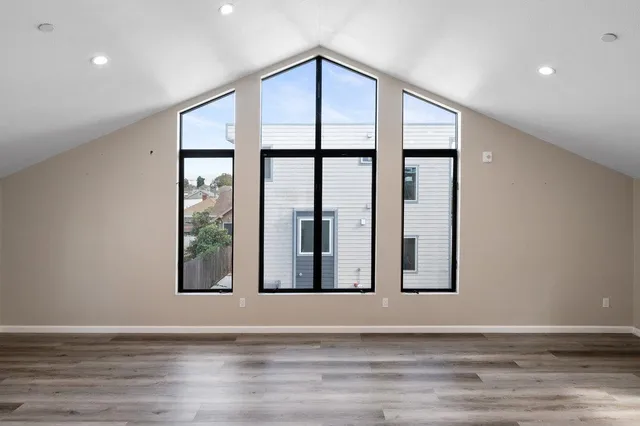 a view of an entryway with wooden floor