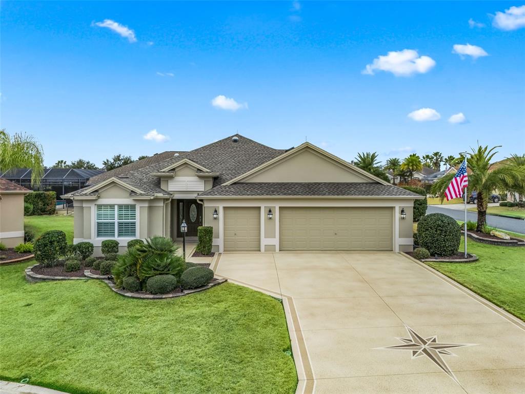 3556 Mistletoe Court The Villages, FL 32163 - Photo 1 of 1 a front view of a house with a garden