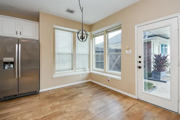 a view interior of a house wooden floor and a ceiling fan