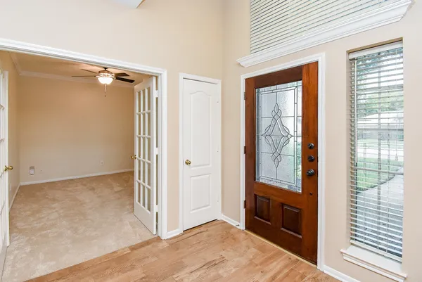 a view of workspace with lounge chair and cabinet