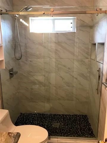 a view of a field of grass and trees