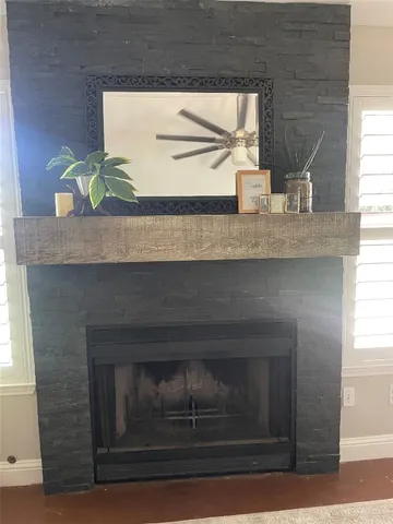 a living room with granite countertop a fireplace