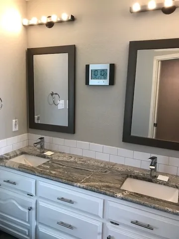 a view of kitchen and empty room