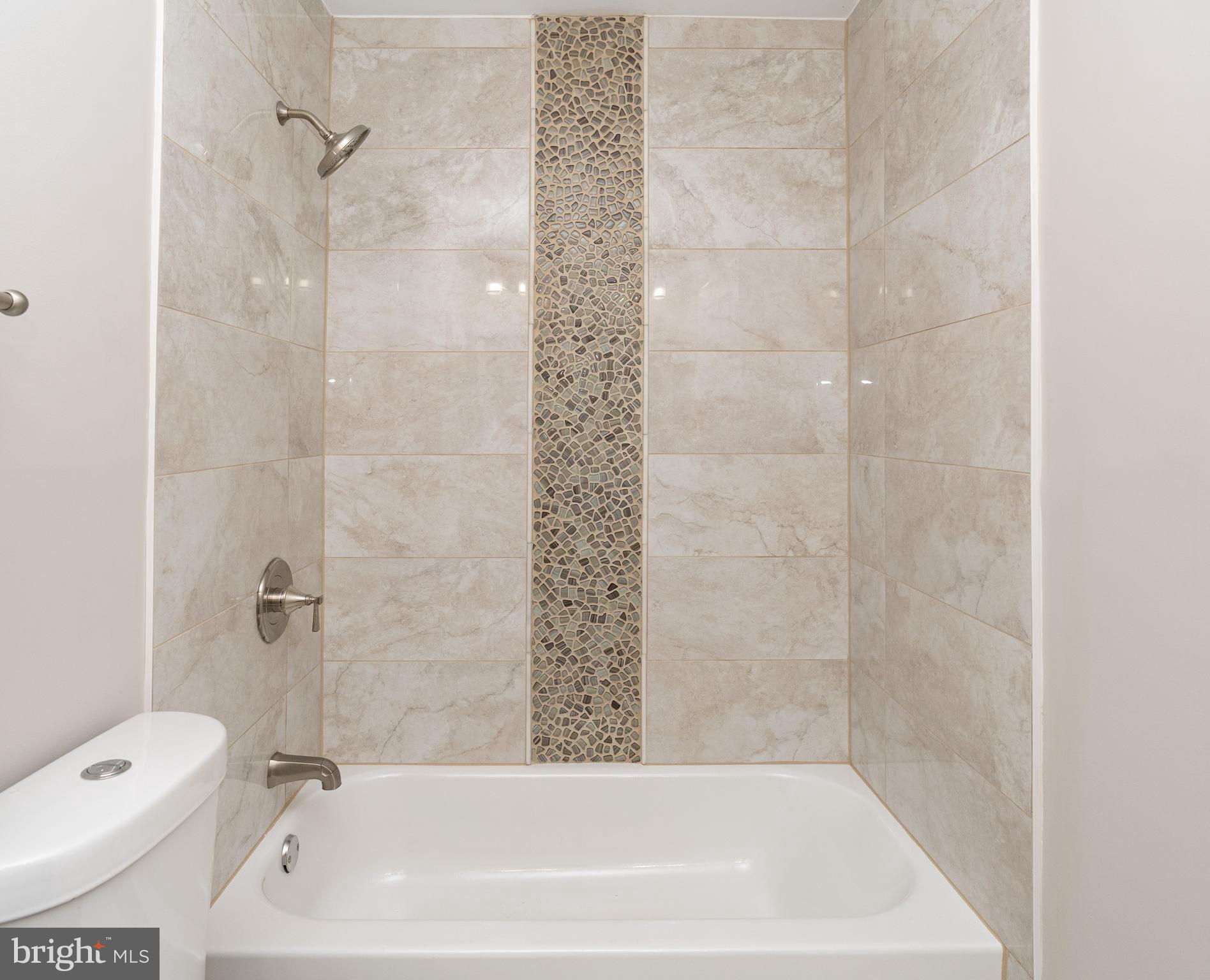 7725 Grasty Road Baltimore, MD 21208 - Photo 33 of 59 Full Bathroom with Tub and Shower