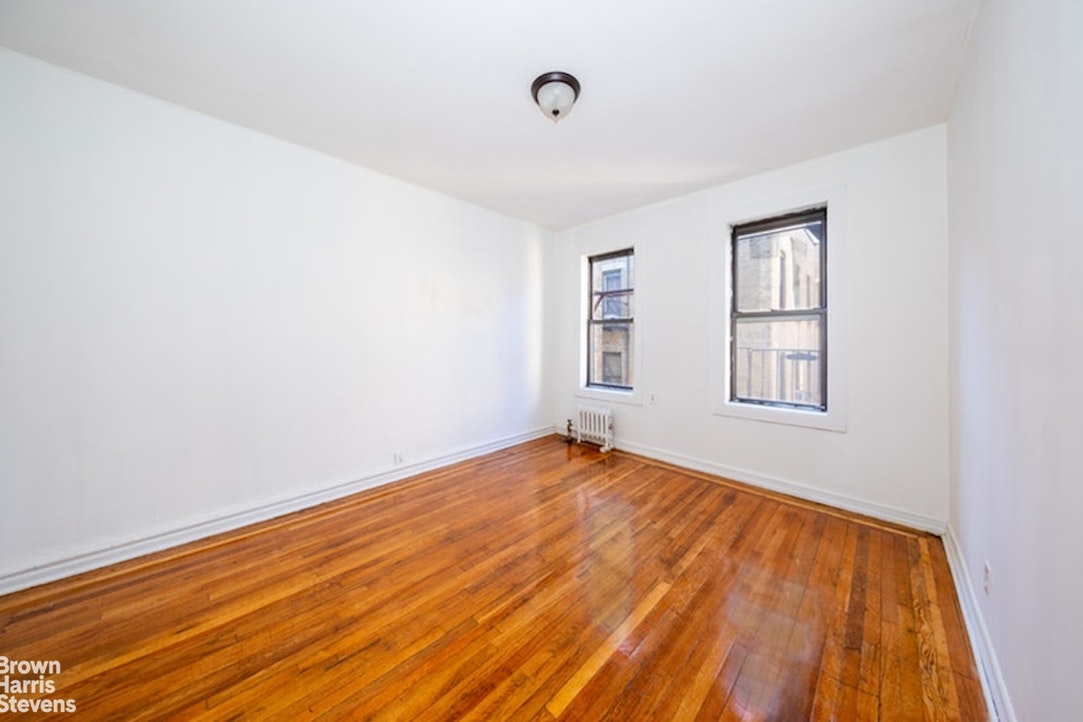 1793 Riverside Drive, Unit 6J Manhattan, NY 10034 - Photo 5 of 7 an empty room with windows
