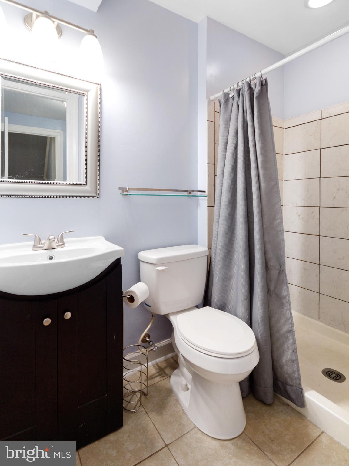5560 Rivendell Place Frederick, MD 21703 - Photo 38 of 44 Full bath in basement with tile shower