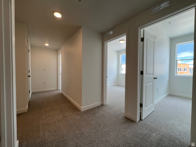 717 West W Coho Lane South, Unit 2F302 Midvale, UT 84047 - Photo 12 of 22 Hallway featuring recessed lighting, neutral paint, and carpet flooring