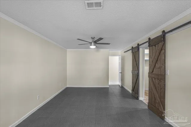a bathroom with a granite countertop sink a toilet a mirror and shower