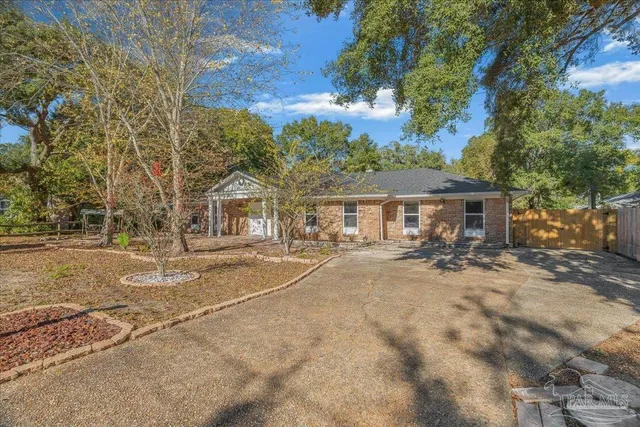 a view of house with outdoor space and sitting area