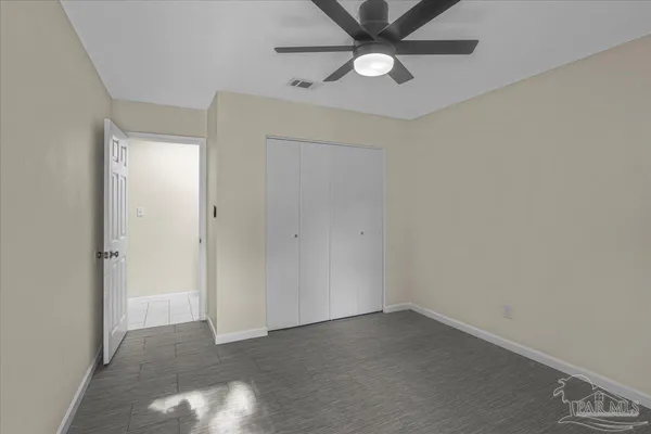 an empty room with window and windows