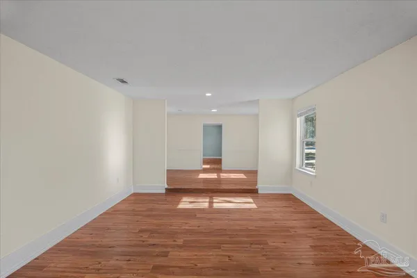 a living room with a wooden floor
