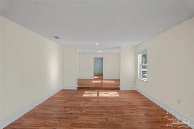 a living room with a wooden floor