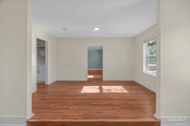 a view of a hallway with a window