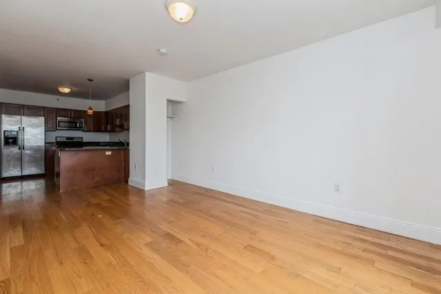 a view of kitchen with wooden floor