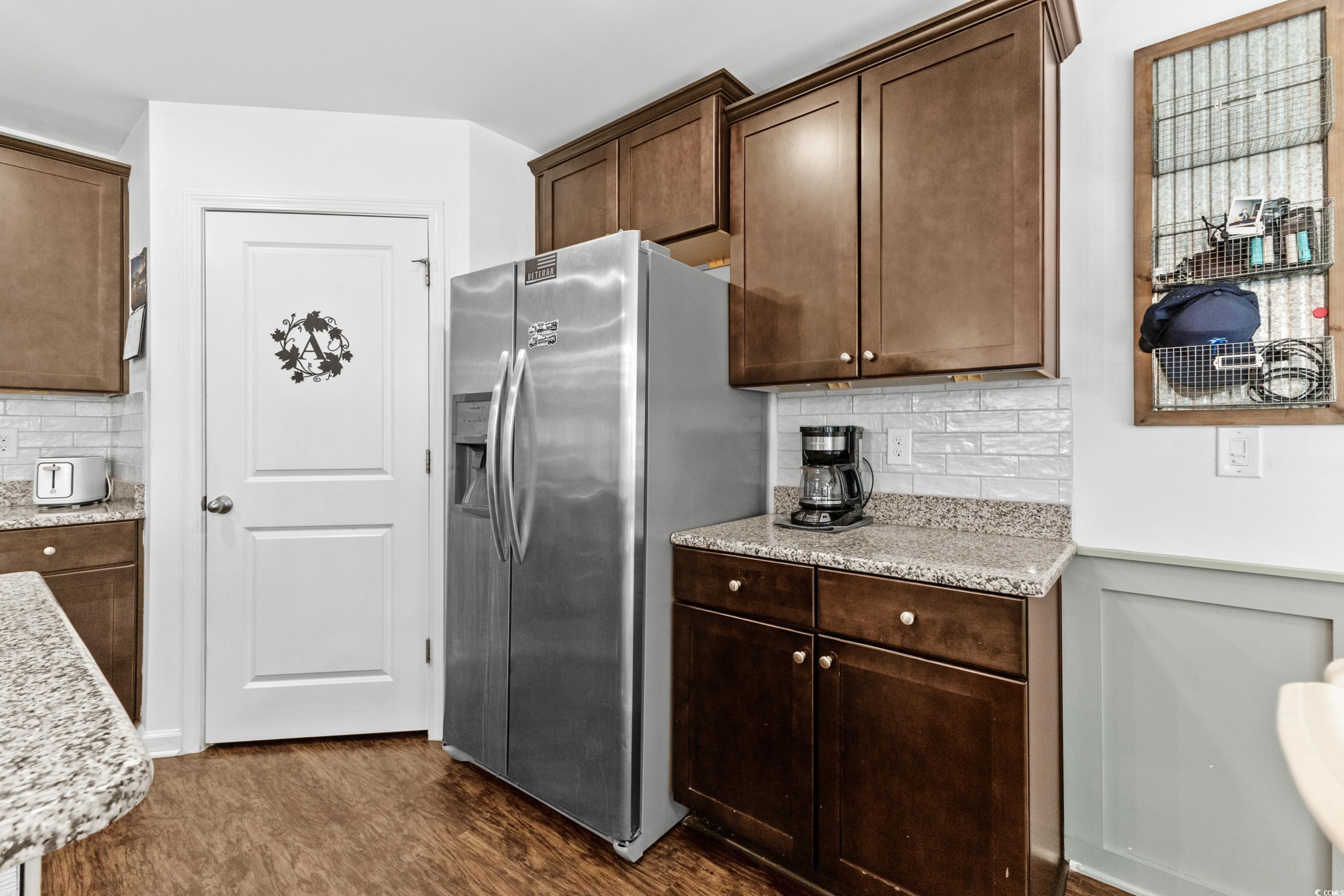 3168 Holly Loop Conway, SC 29527 - Photo 14 of 40 Kitchen with decorative backsplash, dark brown cab