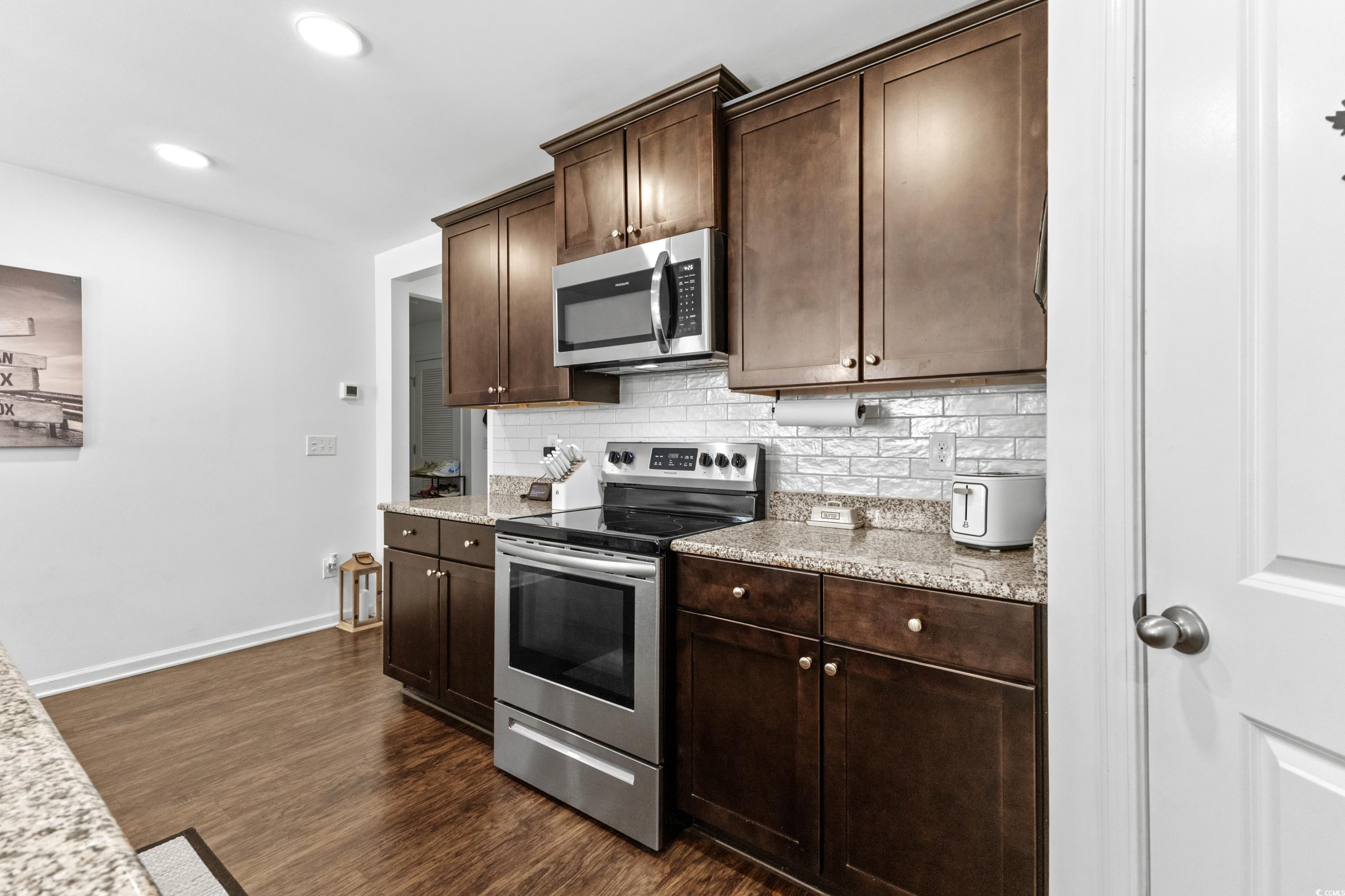 3168 Holly Loop Conway, SC 29527 - Photo 15 of 40 Kitchen with dark brown cabinetry, stainless steel