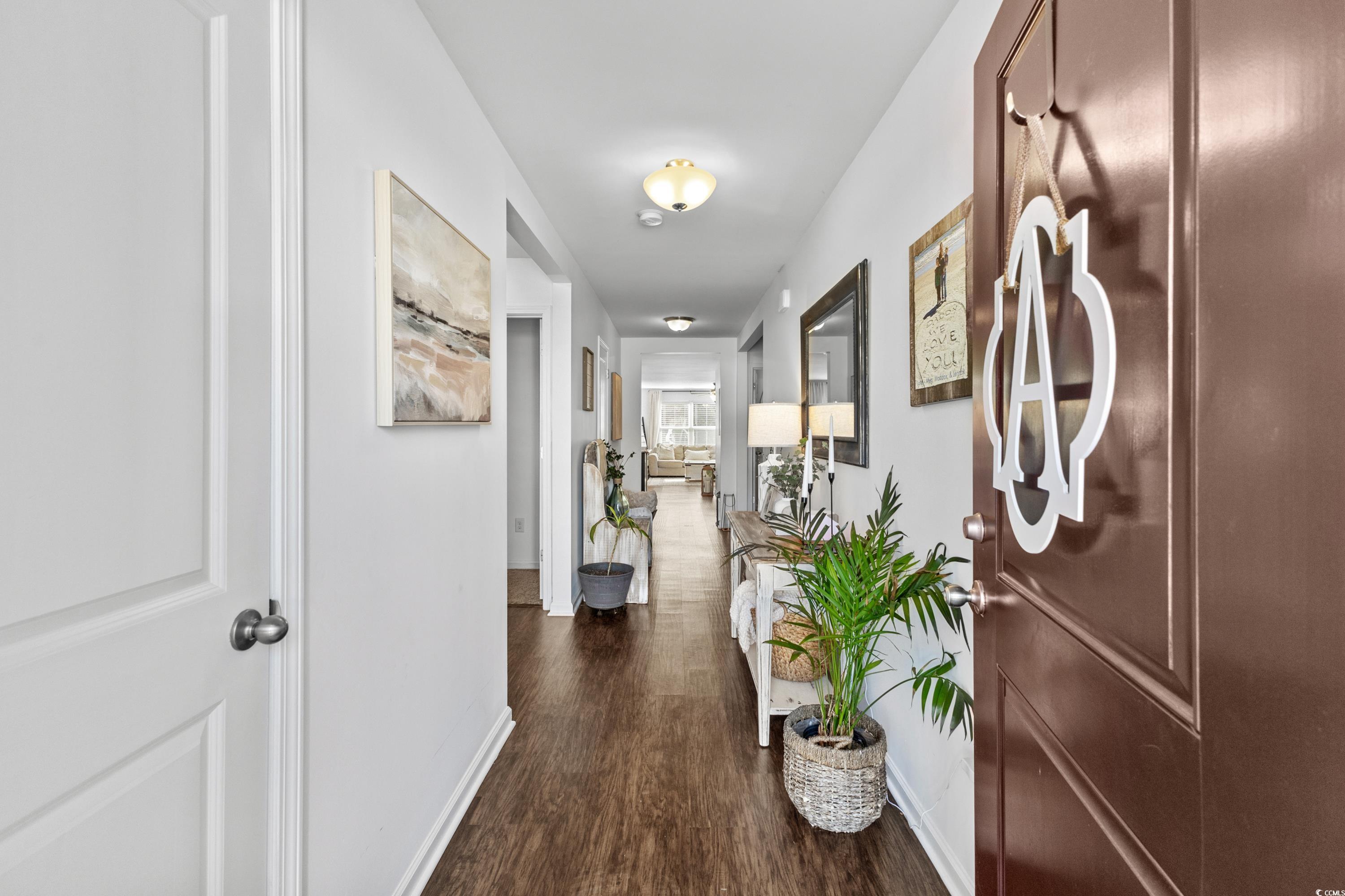 3168 Holly Loop Conway, SC 29527 - Photo 2 of 40 Corridor featuring dark hardwood / wood-style floo
