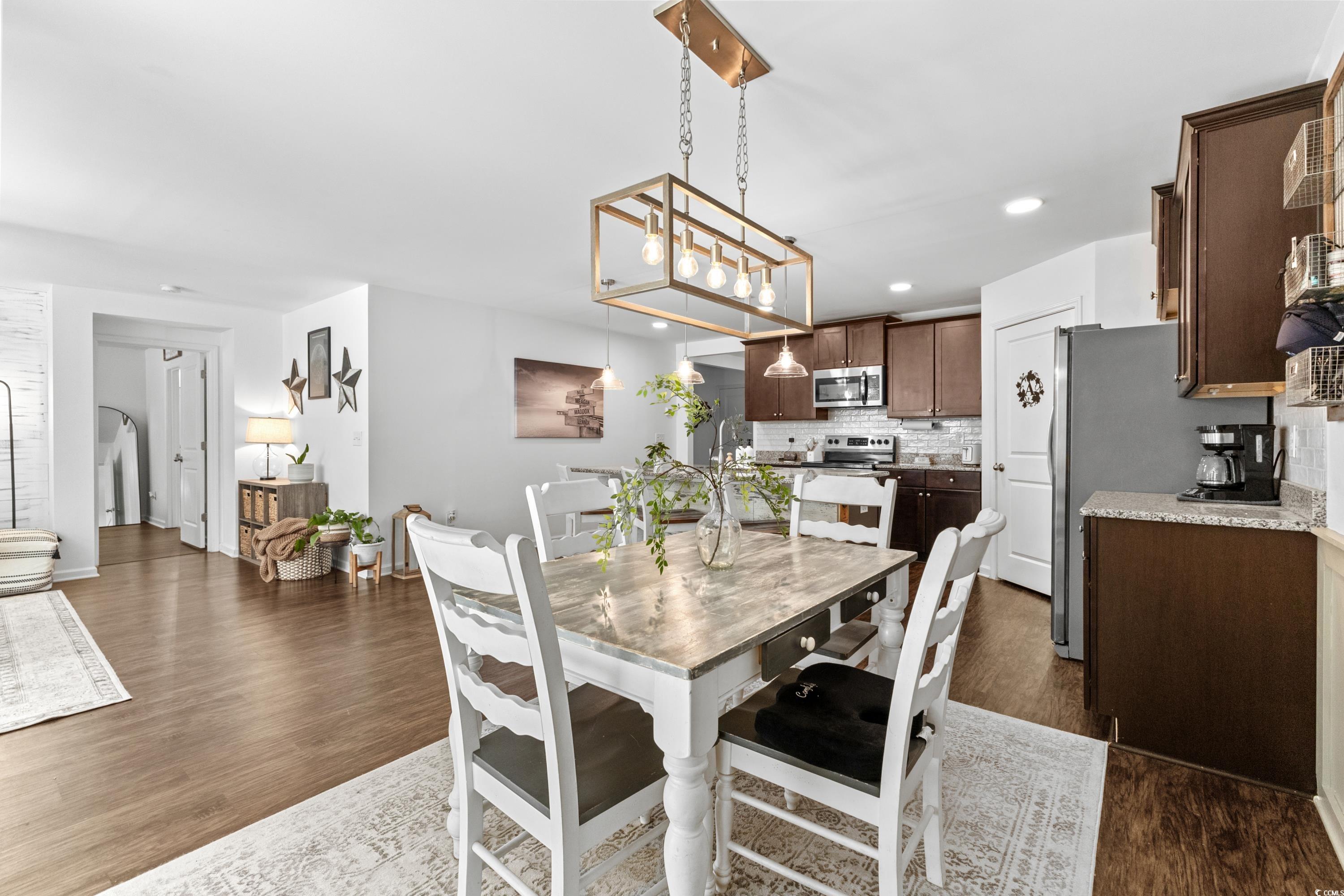 3168 Holly Loop Conway, SC 29527 - Photo 10 of 40 Dining area with sink, dark hardwood / wood-style
