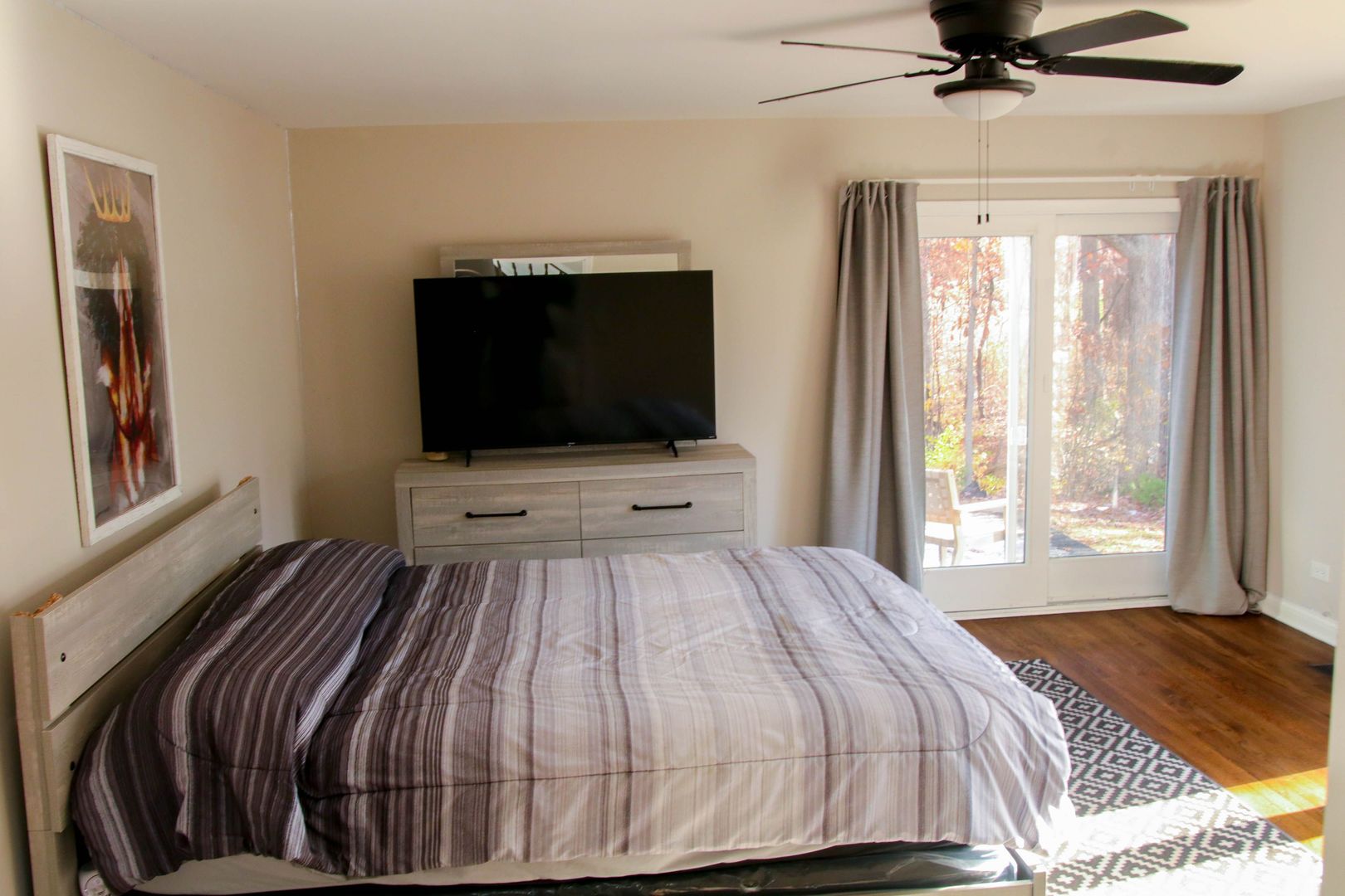 129 Cornwall Drive Crete, IL 60417 - Photo 23 of 31 a bedroom with a bed and a flat screen tv