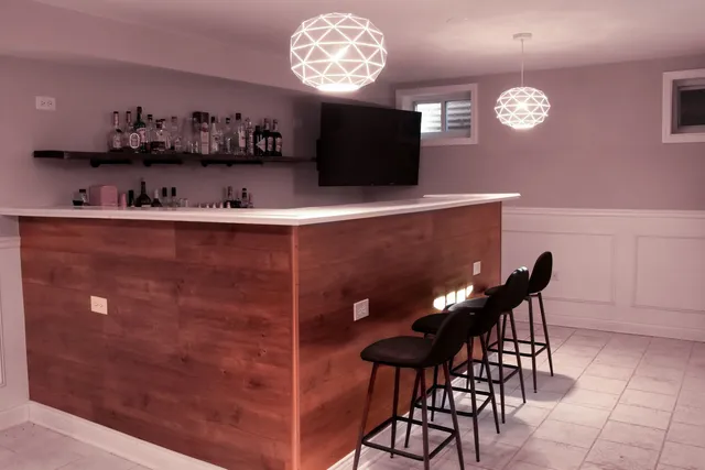 a view of a dining room with furniture and chandelier
