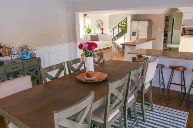 a view of a dining room with furniture and wooden floor