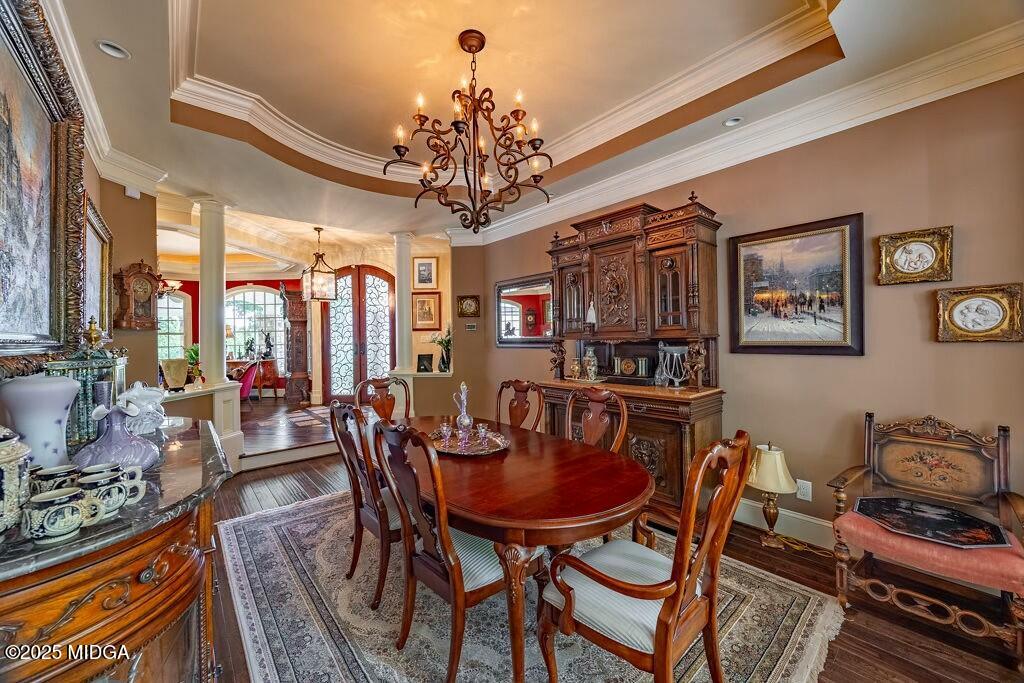 601 River Overlook Forsyth, GA 31029 - Photo 13 of 85 a view of a dining room with furniture a chandelier and large windows