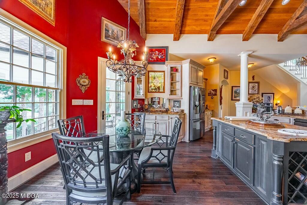 601 River Overlook Forsyth, GA 31029 - Photo 26 of 85 a view of a dining room with furniture a chandelier and wooden floor