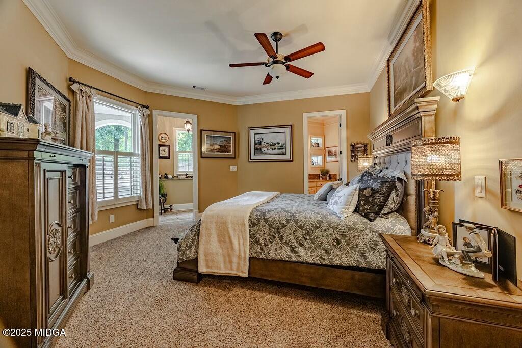601 River Overlook Forsyth, GA 31029 - Photo 38 of 85 a bedroom with a bed next to a flat screen tv with wooden floor