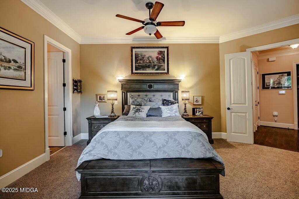601 River Overlook Forsyth, GA 31029 - Photo 39 of 85 a bedroom with a bed and a chandelier