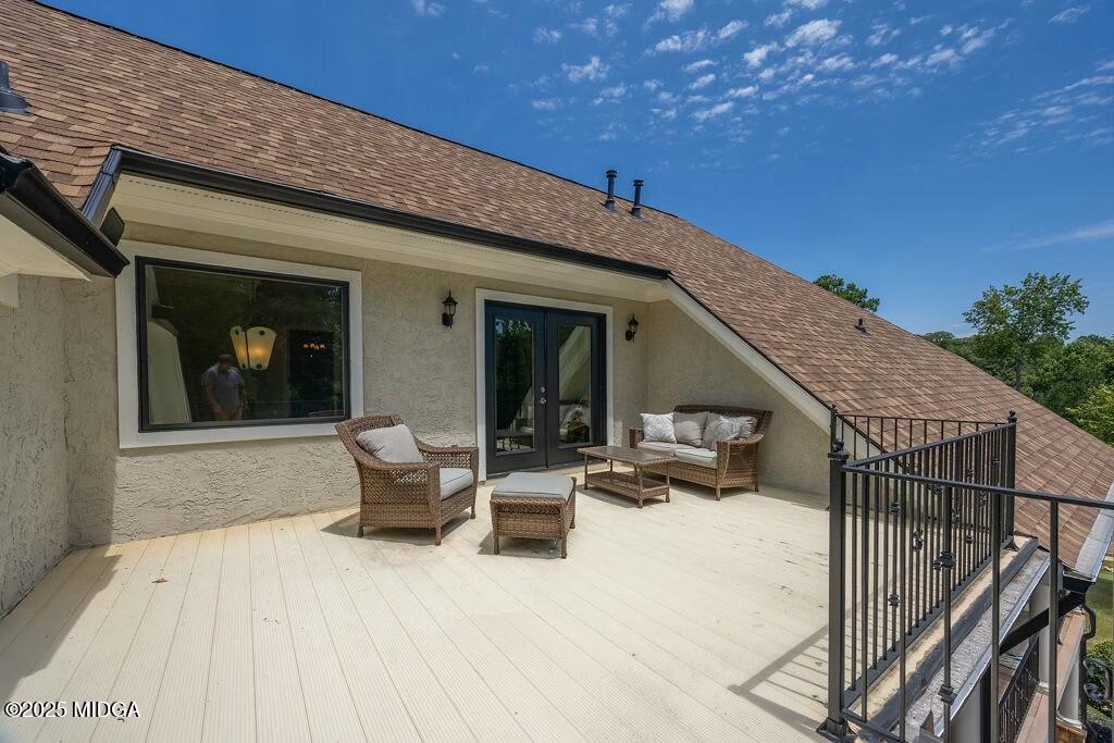 601 River Overlook Forsyth, GA 31029 - Photo 45 of 85 a view of a patio with couches and table and chairs with wooden floor and fence