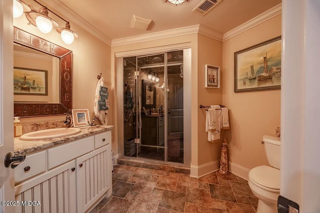 601 River Overlook Forsyth, GA 31029 - Photo 61 of 85 a bathroom with a double vanity sink toilet and shower