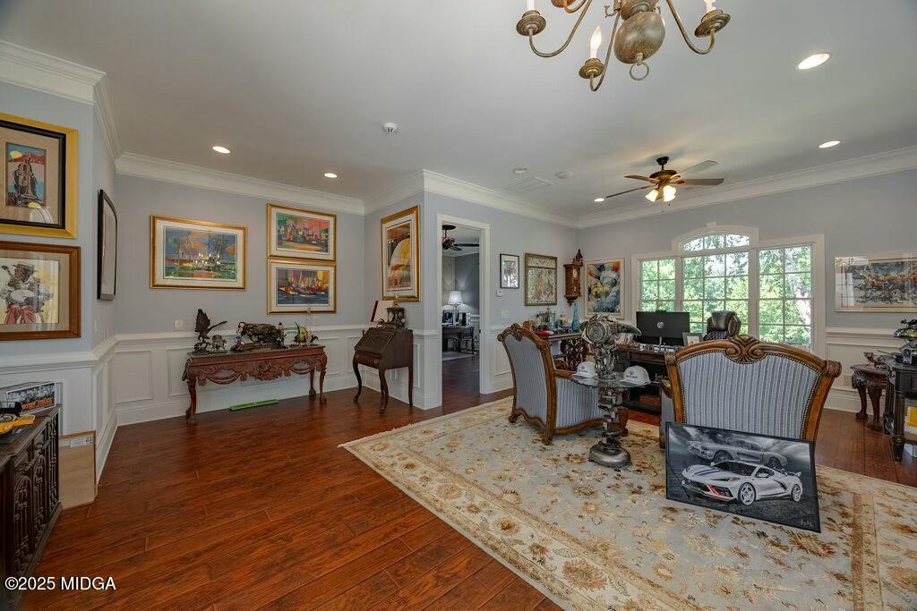 601 River Overlook Forsyth, GA 31029 - Photo 67 of 85 a view of a dining room and livingroom with furniture wooden floor a rug a painting and a chandelier