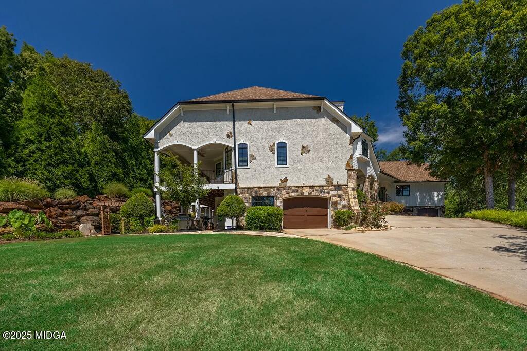 601 River Overlook Forsyth, GA 31029 - Photo 80 of 85 a front view of house with yard and green space